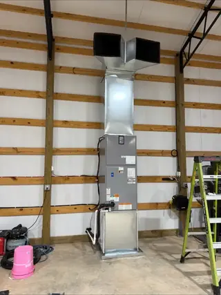 Vertical air handler installation inside a metal building